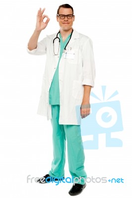Male Doctor Showing Okay Gesture Stock Photo