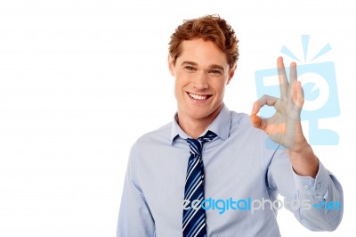 Male Executive Showing Okay Sign Stock Photo