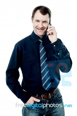 Male Executive Talking Via Mobile Phone Stock Photo