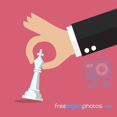 Male Hand Holding Chess Figure Stock Image