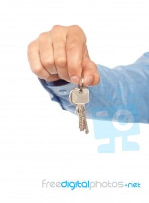 Male Hand Holding Key On White Stock Photo