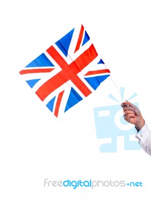 Male Hand Holding UK Flag Stock Photo