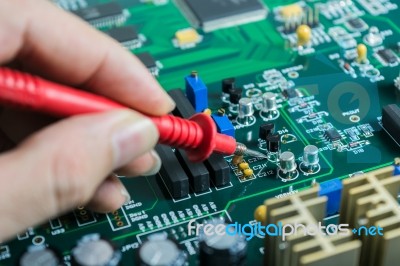 Male Hands Close Up Checking Voltage On Transistor Stock Photo
