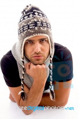 Male Lying And Wearing Woolen Cap Stock Photo