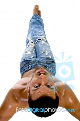 Male Lying Down And Looking Backwards Stock Photo