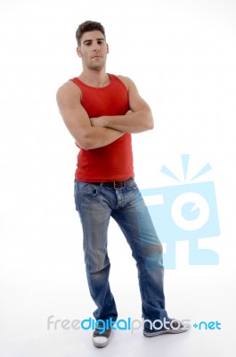 Male Posing In Front Of Camera With Crossed Arms Stock Photo