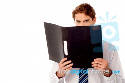 Male Secretary In Anger Reviewing File Stock Photo