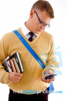 Male Student Typing Sms On Mobile Stock Photo