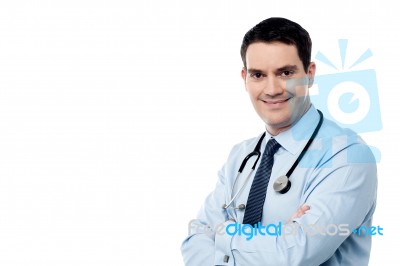 Male Surgeon Posing With Folded Arms Stock Photo