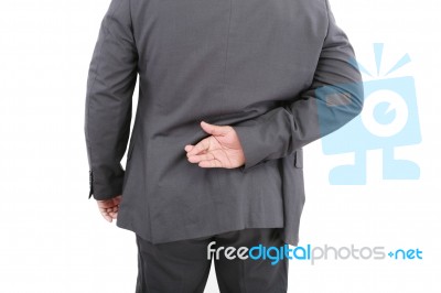 Male With Fingers Crossed Stock Photo