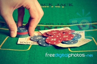 Man Betting On Poker Stock Photo