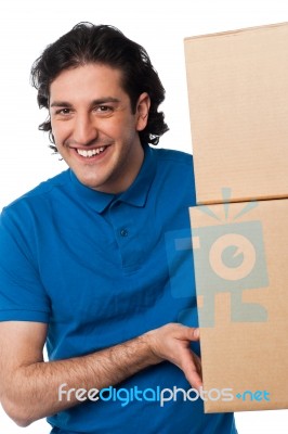 Man Carrying Couple Of Cardboard Boxes Stock Photo