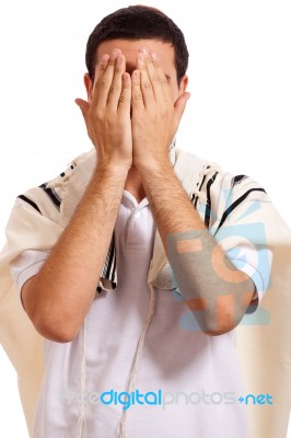 Man Closing His Face By Hands Stock Photo