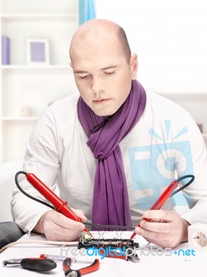 Man Doing Minor Repair At Home Stock Photo