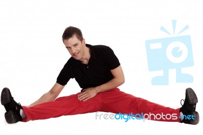 Man Doing Streching Exercise Stock Photo