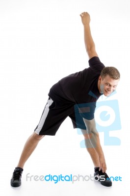 Man Doing Stretching Exercise Stock Photo