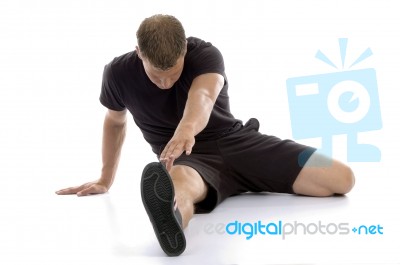 Man doing Stretching exercise Stock Photo