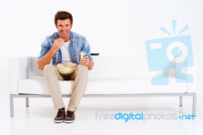 Man Eating While Watching Tv Stock Photo