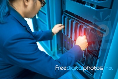 Man Fix Server Network In Data Center Room Stock Photo