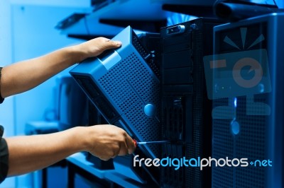 Man Fix Server Network In Data Center Room Stock Photo