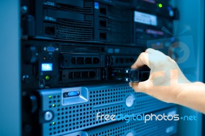 Man Fix Server Network In Data Center Room Stock Photo