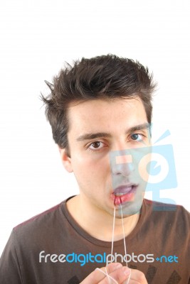 Man Flossing His Teeth (don't Want Expression) Stock Photo