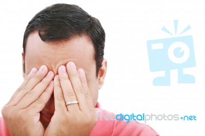 Man Frustrated With Hands On Face Stock Photo