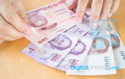 Man Hand Counting Thai Baht Banknote Stock Photo