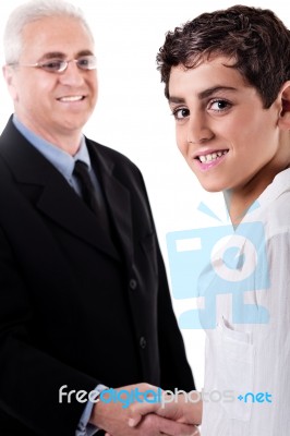 Man Handshake With Young Boy Stock Photo