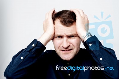 Man Having Headache Isolated Over White Stock Photo