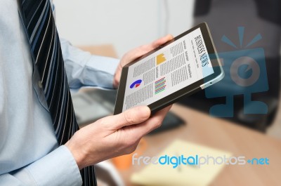 Man Holding A Digital Tablet Stock Photo