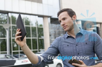 Man Holding I-pad Tablet Computer Stock Photo