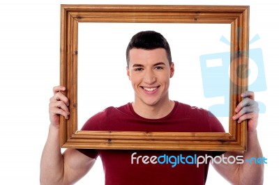 Man Holding Wooden Picture Frame Stock Photo
