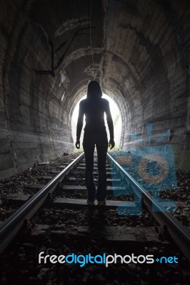 Man In A Tunnel Looking Towards The Light Stock Photo Man In A Tunnel Looking Towards The Light Stock Photo