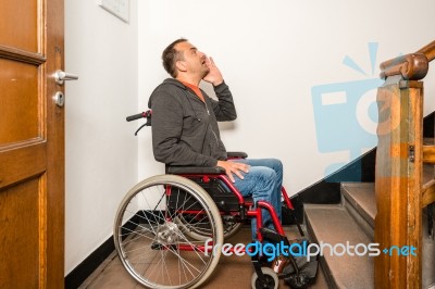 Man In Wheelchair Facing A Barrier Of Stairs Stock Photo Man In Wheelchair Facing A Barrier Of Stairs Stock Photo