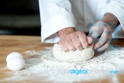 Man Kneading Dough, Closeup Shot Stock Photo