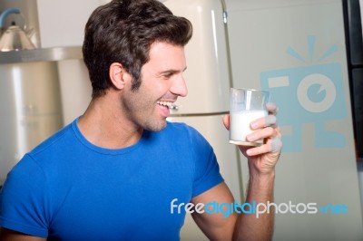 Man Liking Milk Stock Photo