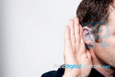 Man Listening To Gossip Stock Photo