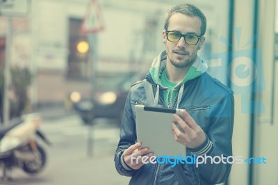 Man On Street Use Ipad Tablet Computer Stock Photo