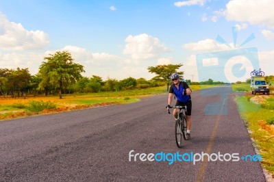 Man On The Bicycle In Africa Stock Photo