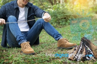 Man Overroast Their Marshmallow Candies On The Campfire On Campi… Stock Photo