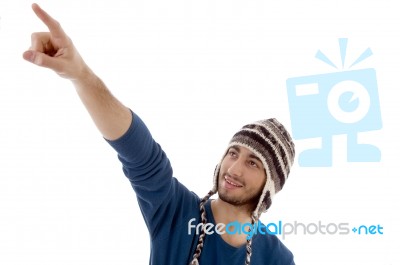 Man Pointing Up With Cap Stock Photo