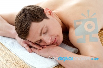 Man Relaxing In A Spa Resort On Mat Stock Photo