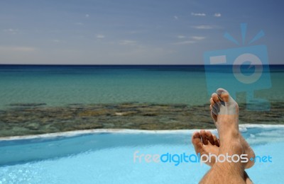 Man Resting Over The Sea Stock Photo