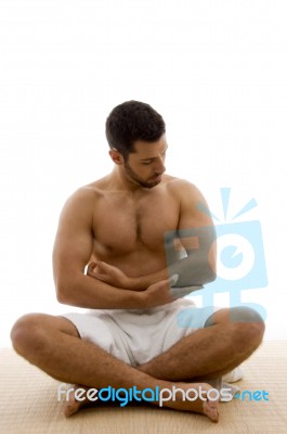 Man Sitting With Legs Crossed Stock Photo