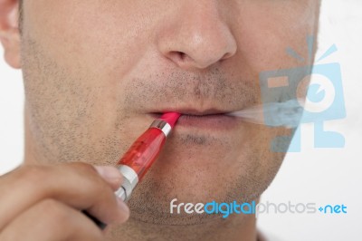 Man Smoking Electric Cigarette Stock Photo