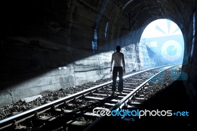 Man Standing In Tunnel Stock Photo