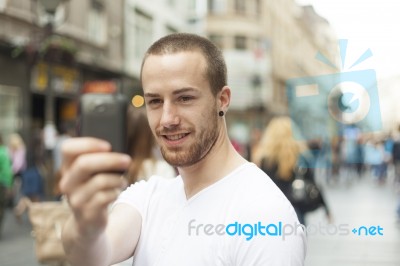 Man Taking Photo With Mobile Phone Stock Photo