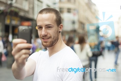 Man Taking Photo With Mobile Phone Stock Photo