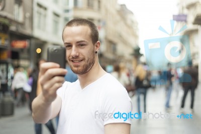 Man Taking Photo With Mobile Phone Stock Photo